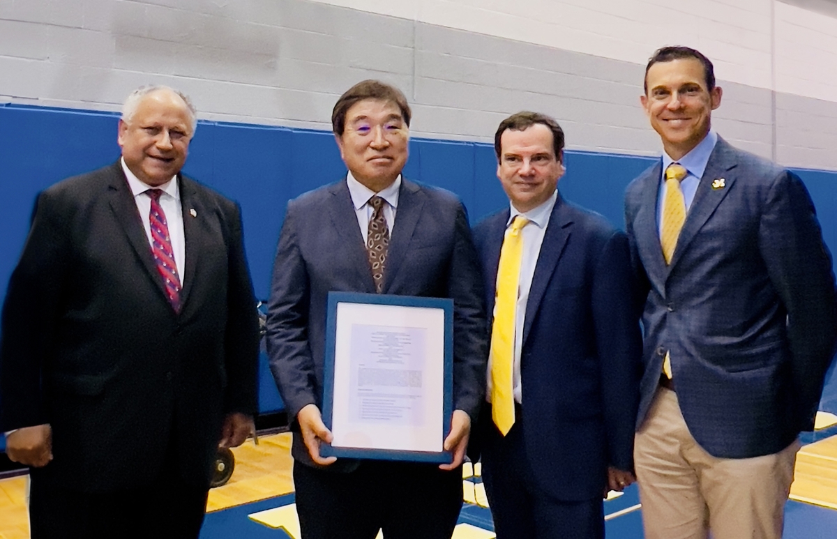 From left, U.S. Secretary of the Navy Carlos Del Toro; Shin Hyung-Kye, technical advisor, HD Korea Shipbuilding & Marine Engineering; Steve Brock, special assistant to the secretary of the Navy; and Jonathan Page, professor of shipbuilding and ocean engineering at the University of Michigan